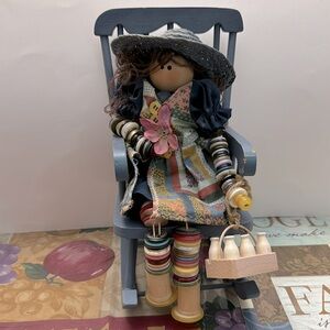 Vintage handcrafted  button milk maid on a racking chair figuring